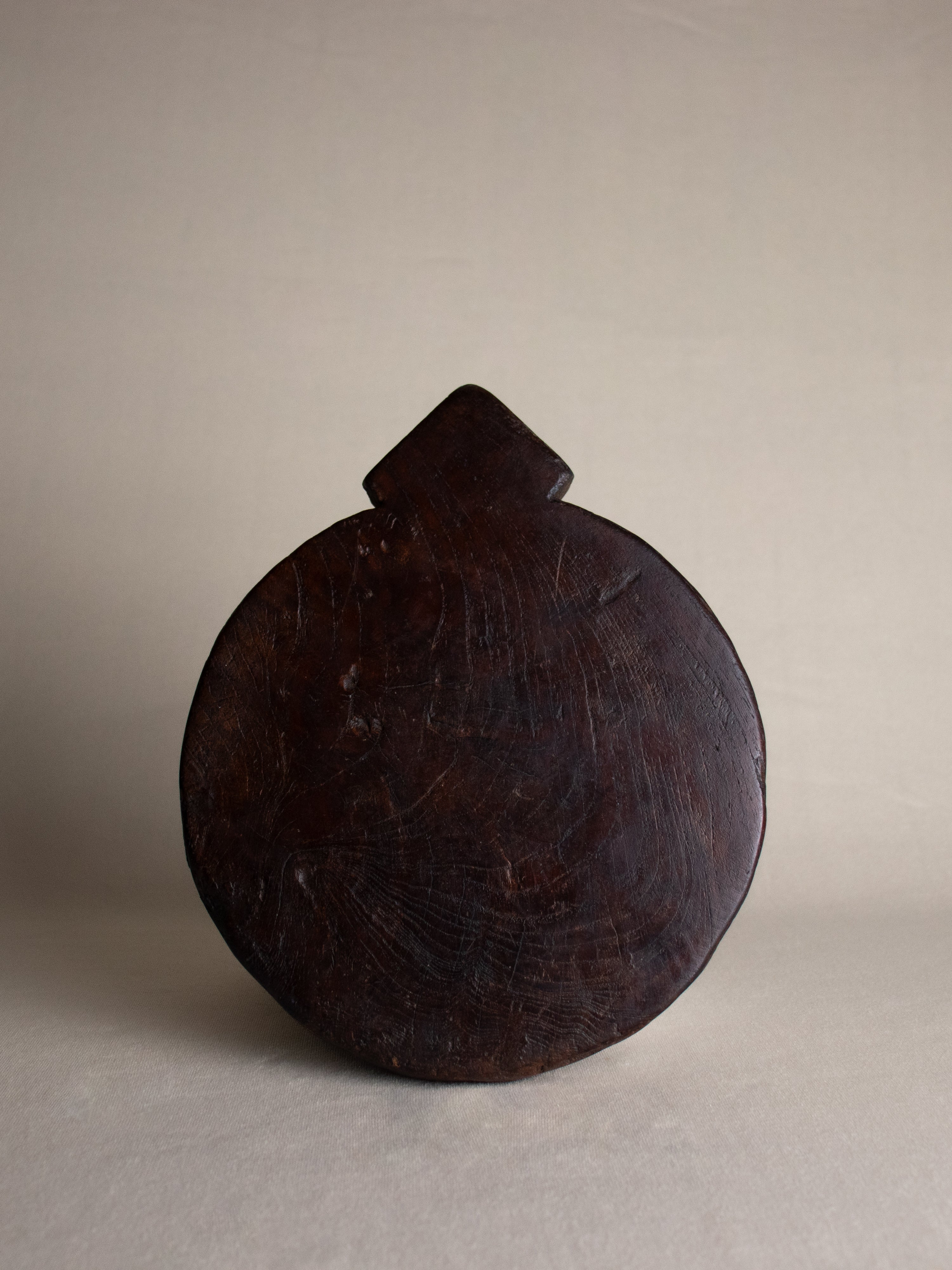 Dark wood chapati board with handle for serving or decor